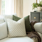 Stella blue floral throw pillow cover on a neutral sofa