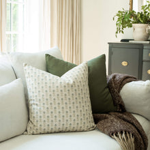 Stella blue floral throw pillow cover on a neutral sofa