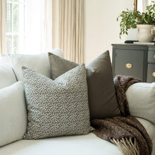 Camille ditsy floral throw pillow cover on a sofa