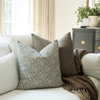 Adeline blue ditsy floral throw pillow cover on a sofa