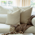 Stella blue and sage ditsy pillow in a bright living room