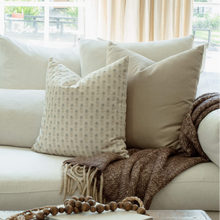 Stella blue and sage ditsy pillow in a bright living room