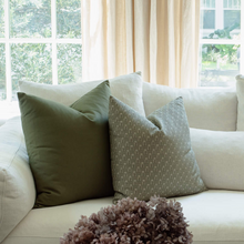 Vivienne sage floral pillow with blue and ivory pillows in a modern living room