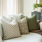 Pippa brown ditsy pillow with taupe floral and olive pillows on a sofa