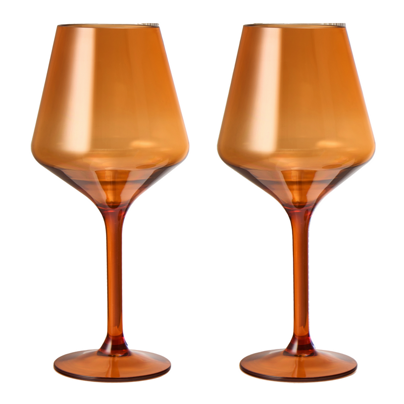 Set of 2 Saint Tropez burnt orange acrylic stemmed wine glasses on outdoor table