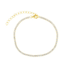Chloe Tennis Bracelet gold plated with CZ stones displayed on neutral fabric