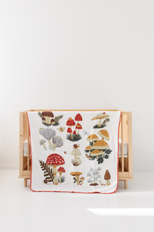 47x47 cotton muslin quilt styled in nursery setting