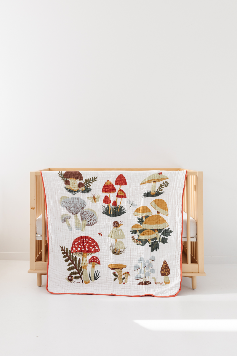 47x47 cotton muslin quilt styled in nursery setting