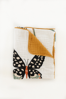 Butterfly Throw Blanket folded neatly on sofa