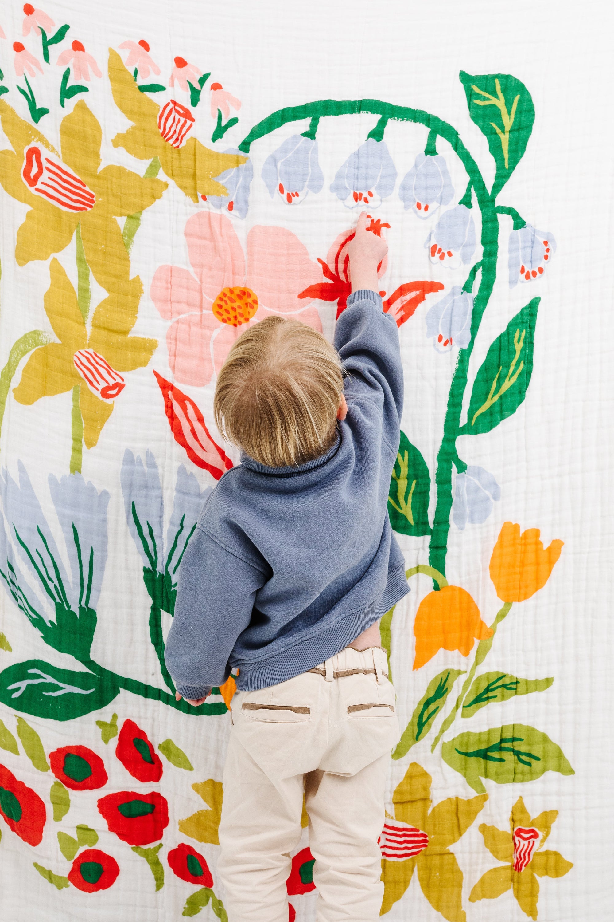 Clementine Kids Cottage Garden Throw folded on couch