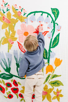 Clementine Kids Cottage Garden Throw folded on couch