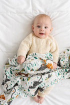 Cotton muslin swaddle blanket with illustrated National Parks mini icons