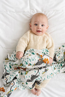 Cotton muslin swaddle blanket with illustrated National Parks mini icons