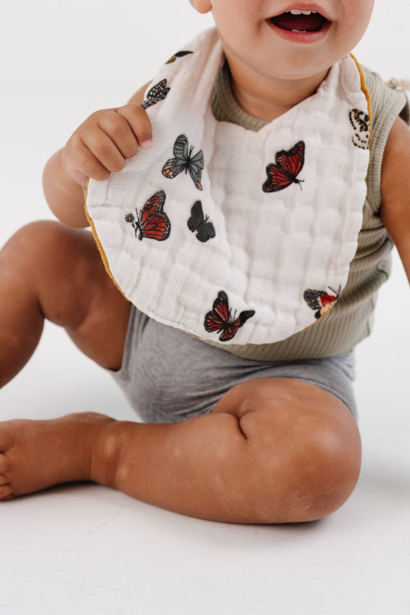 Clementine Kids butterfly bib styled on baby outfit