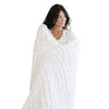 Double Ruched Faux Fur XL Throw Blanket draped over bed