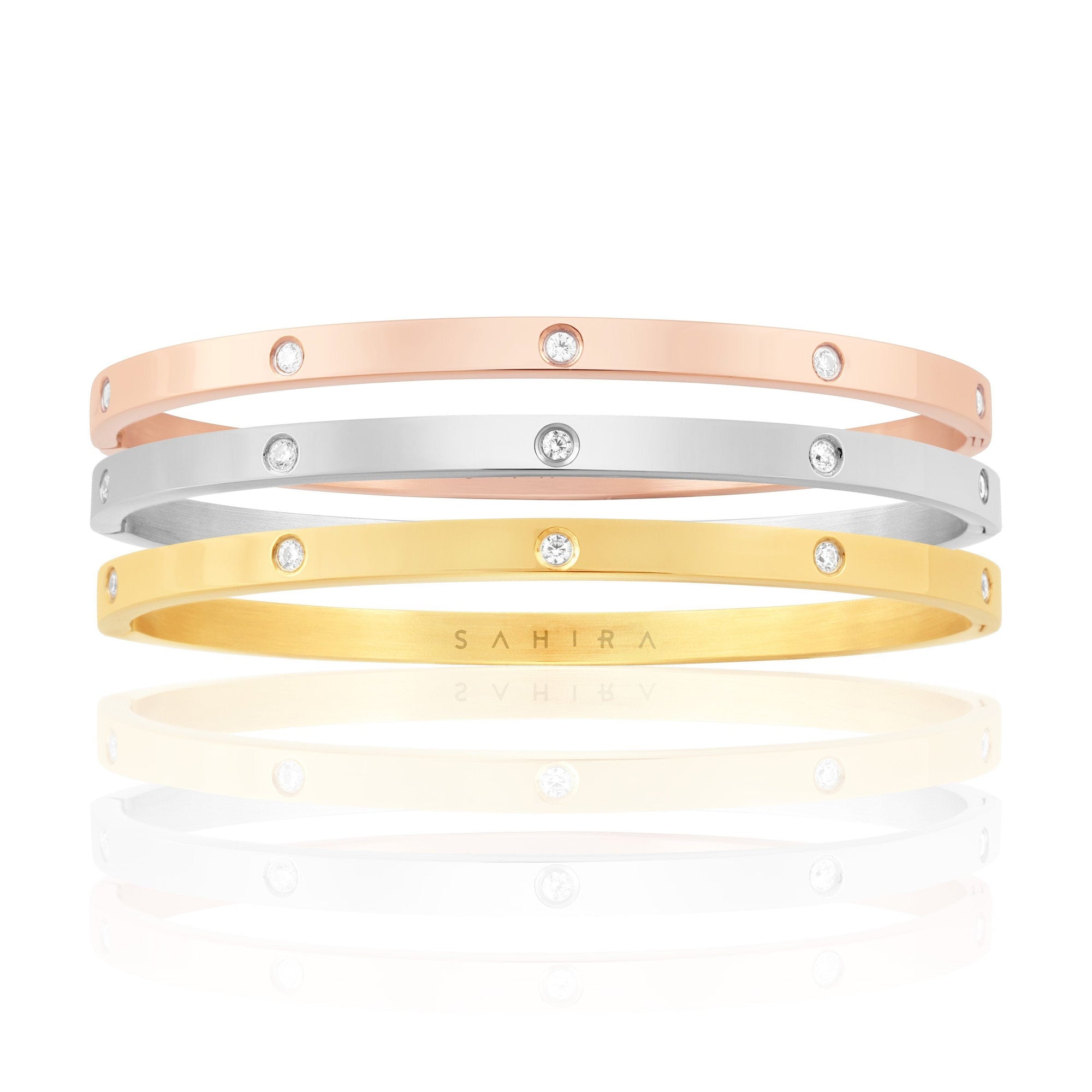 Elsie Trio Stack featuring gold, rose gold, and silver eternity bracelets