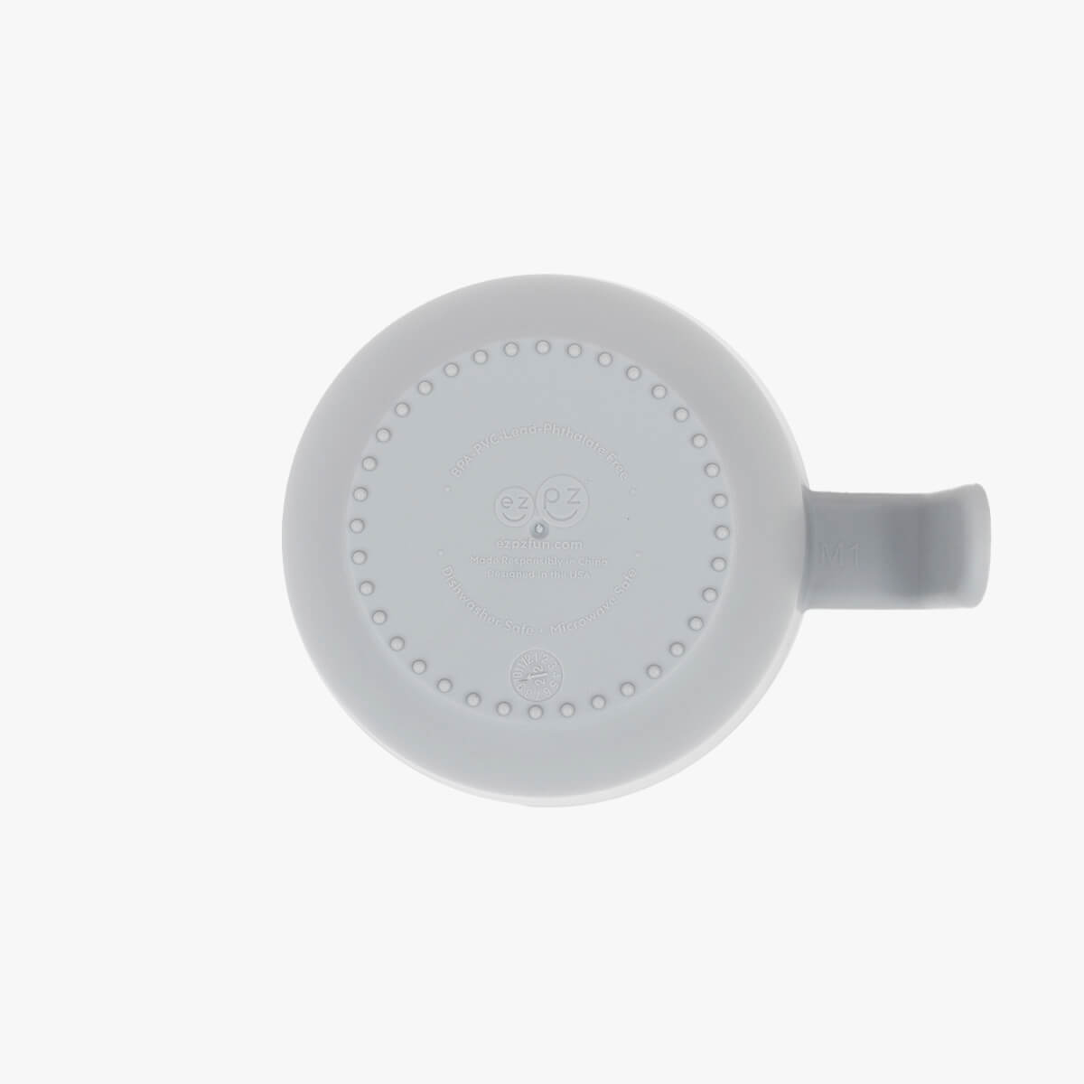 Toddler holding ezpz snack bowl with easy-grip handle