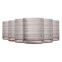 Tonal hobnail glassware styled with cocktails and citrus garnish