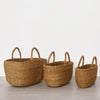 Handwoven oval storage basket in natural golden tones