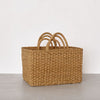 Rustic hogla grass storage baskets in natural golden tones