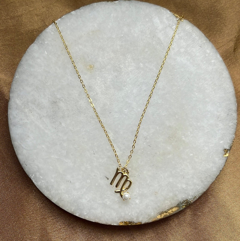 Sterling silver zodiac necklace styled on model