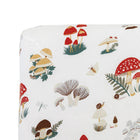 Mushroom cotton muslin crib sheet styled on crib mattress