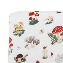 Mushroom cotton muslin crib sheet styled on crib mattress