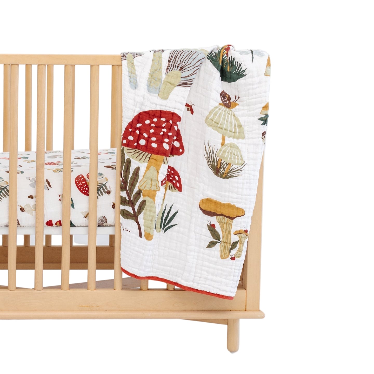 Mushroom print quilt with rusty red reverse side