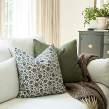Celine navy blue vintage floral throw pillow cover on a sofa