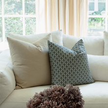 Noelle indigo pillow with ivory pillows on an organic modern sofa