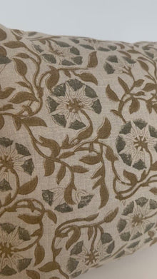 Botanical-inspired pillow cover styled on living room sofa