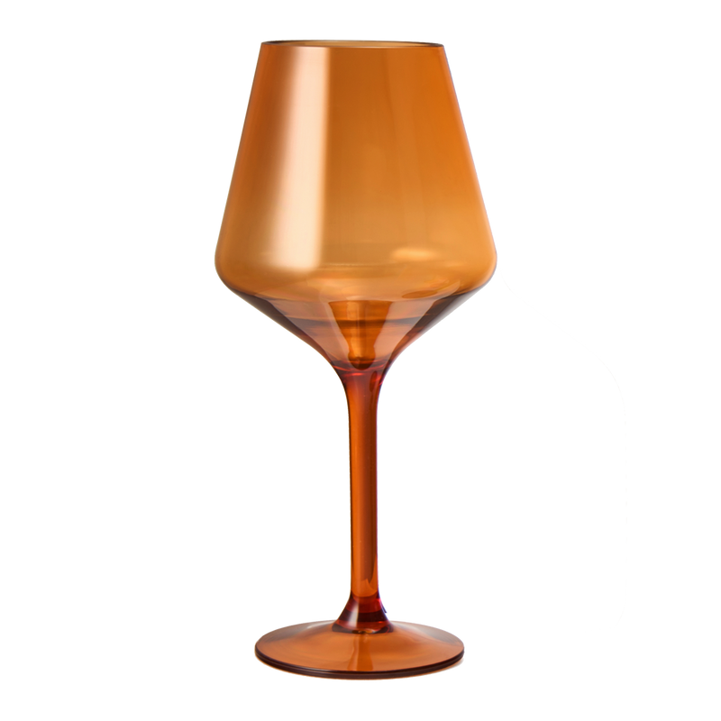 Close-up of burnt orange wine glass filled with red wine