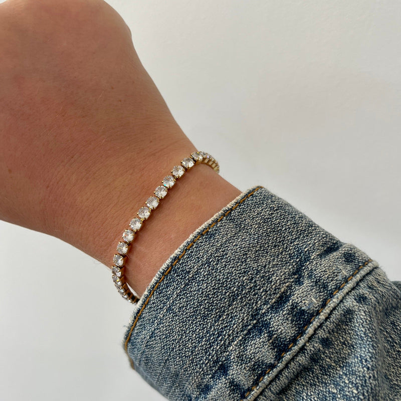 Close-up of Rhae Tennis Bracelet gold-plated links and stones