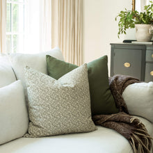 Sylvie sage green mini floral throw pillow cover on a sofa