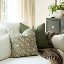 Esme sage and taupe botanical throw pillow cover on a sofa