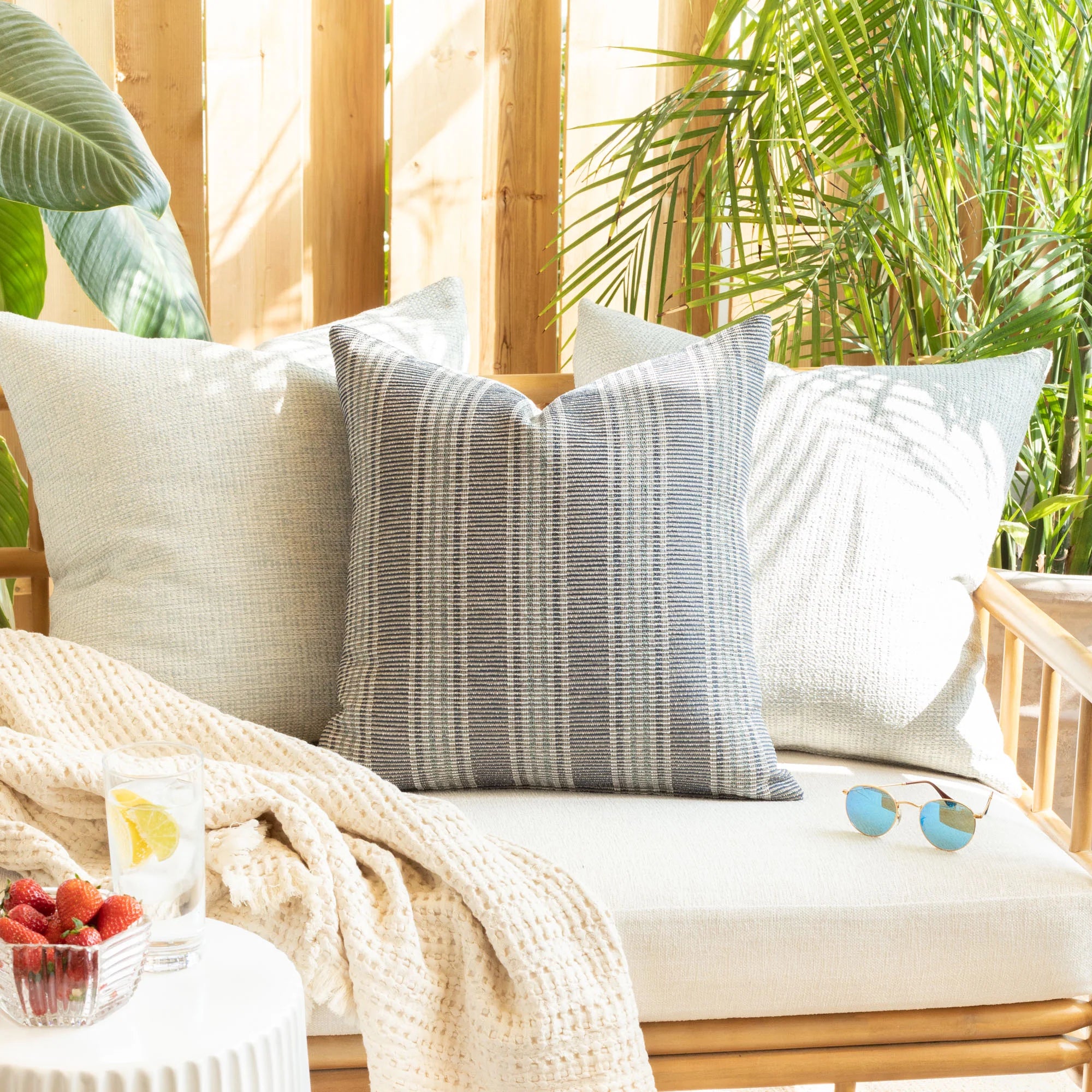 Sonora Stripe Indoor/Outdoor Pillow Cover on an outdoor sofa