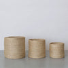 Set of three tall jute storage baskets in natural fiber