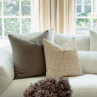 Fleur sand floral pillow in an organic modern living room