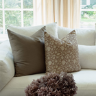 Madeleine taupe floral pillow in a neutral sofa arrangement