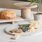 Sustainable serving board styled with fruits and cheeses