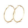 Zoey Hoops oversized 18k gold filled hoop earrings on display