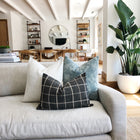 a bunch of pillows on a couch