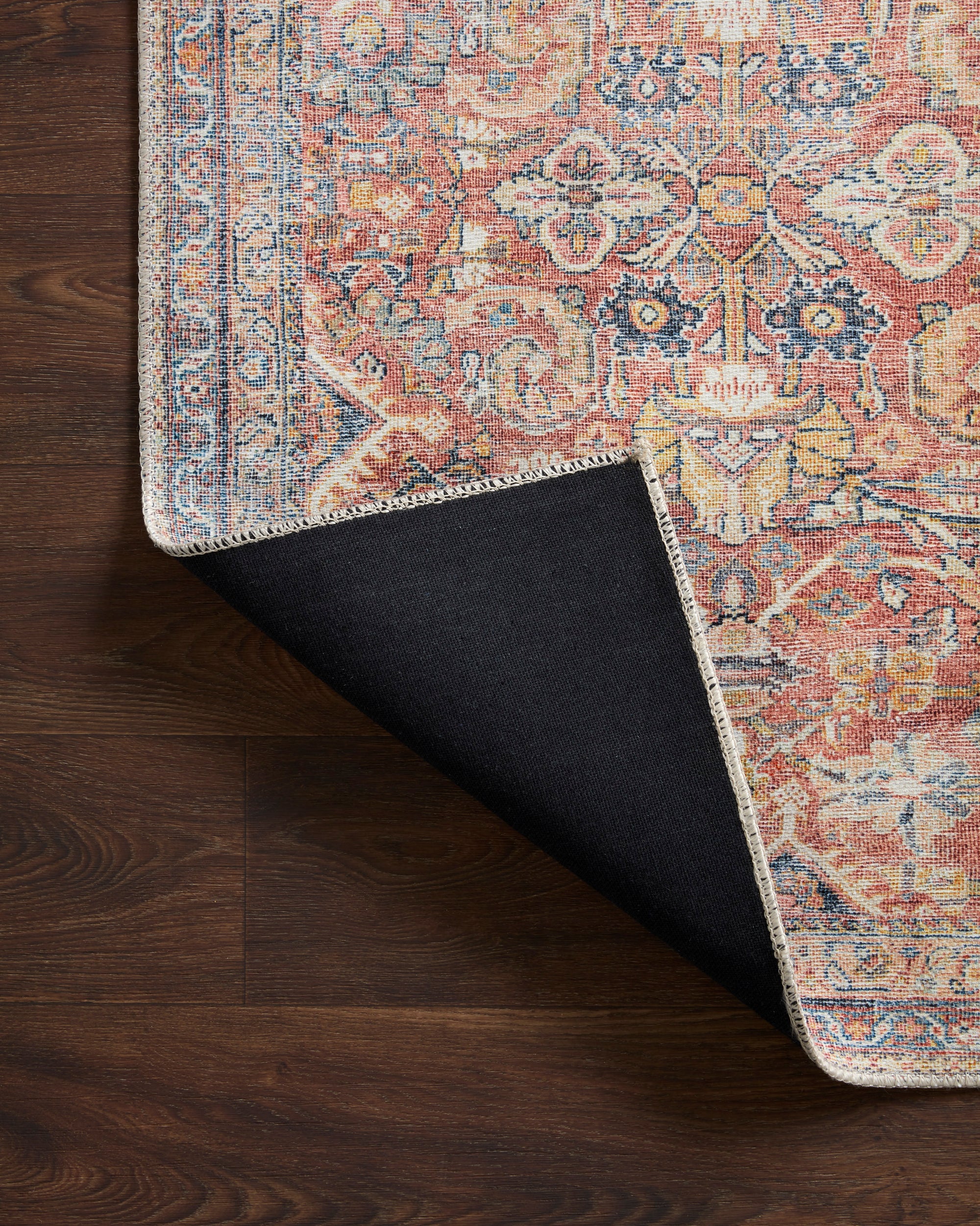 Cara Blue/Rust Rug with corner folded