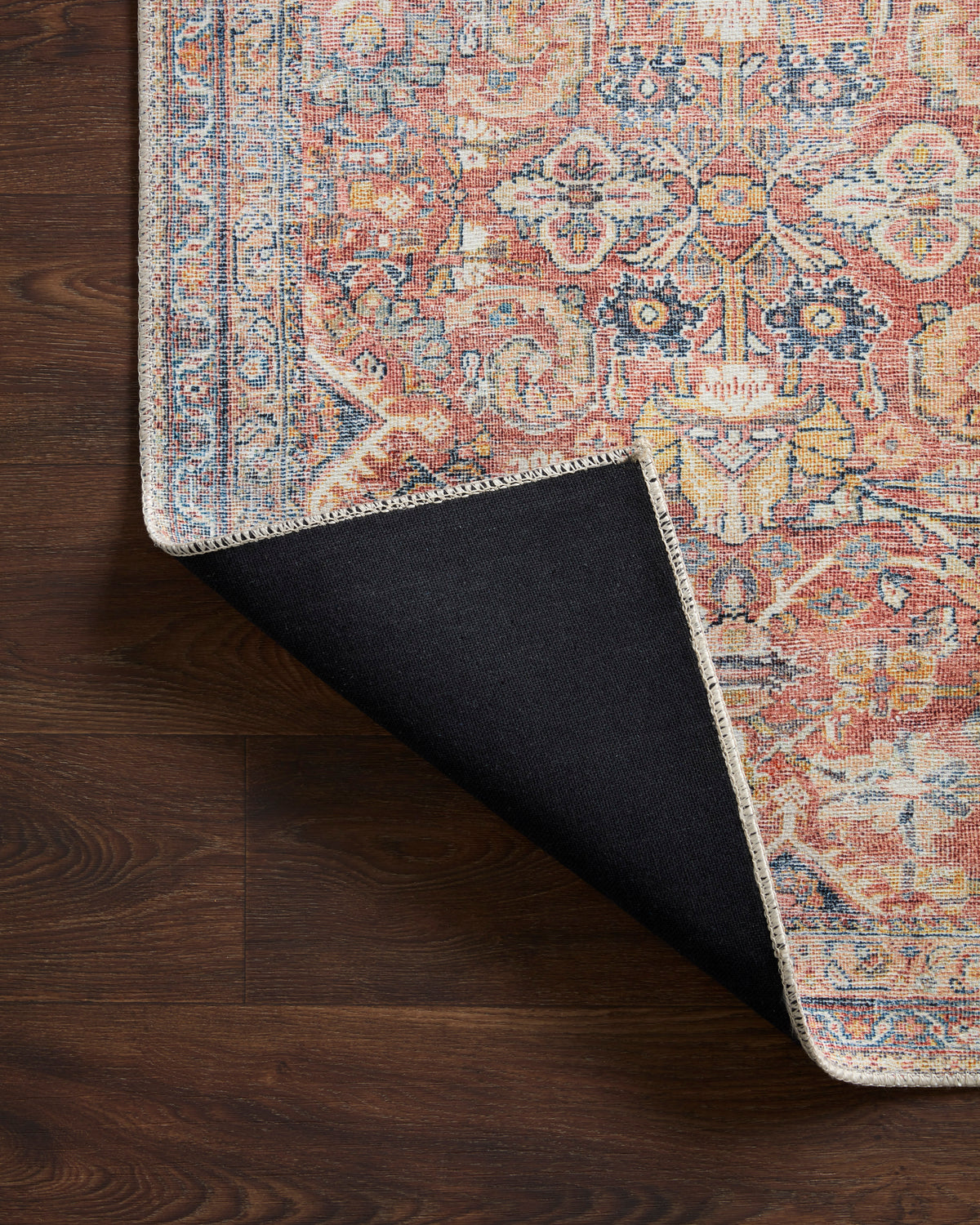 Cara Blue/Rust Rug with corner folded