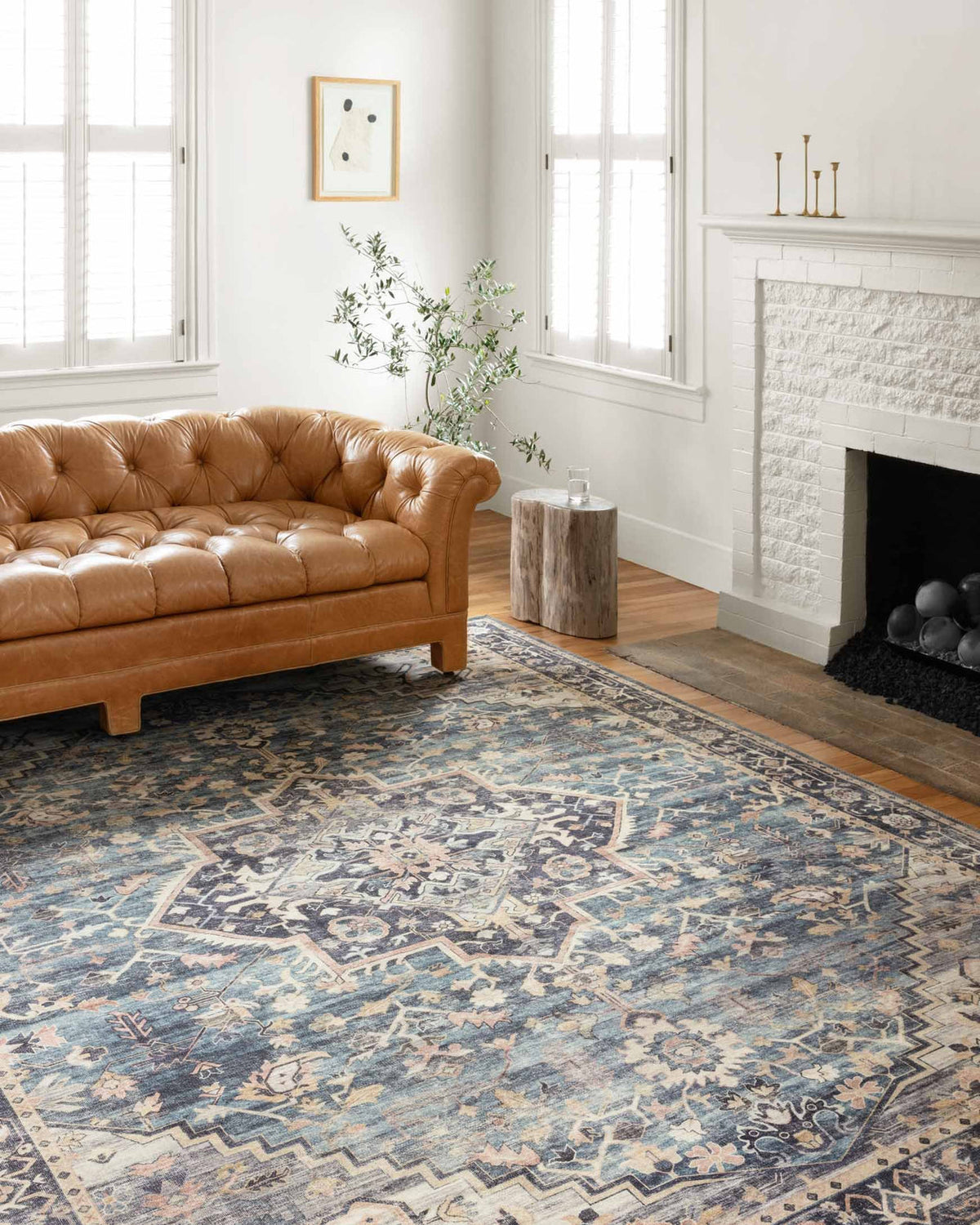 Anne Rose/Azul rug with a brown couch on top