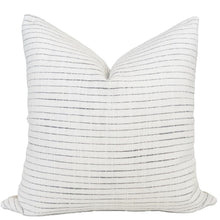 White coastal pillow cover with thin woven blue stripes. 