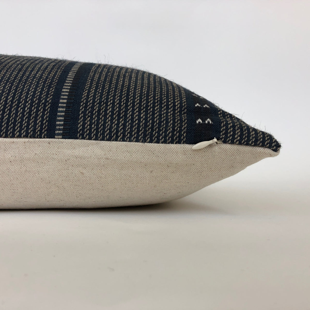 side view of the navy florence pillow cover