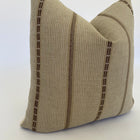 a brown pillow smiling or the camera