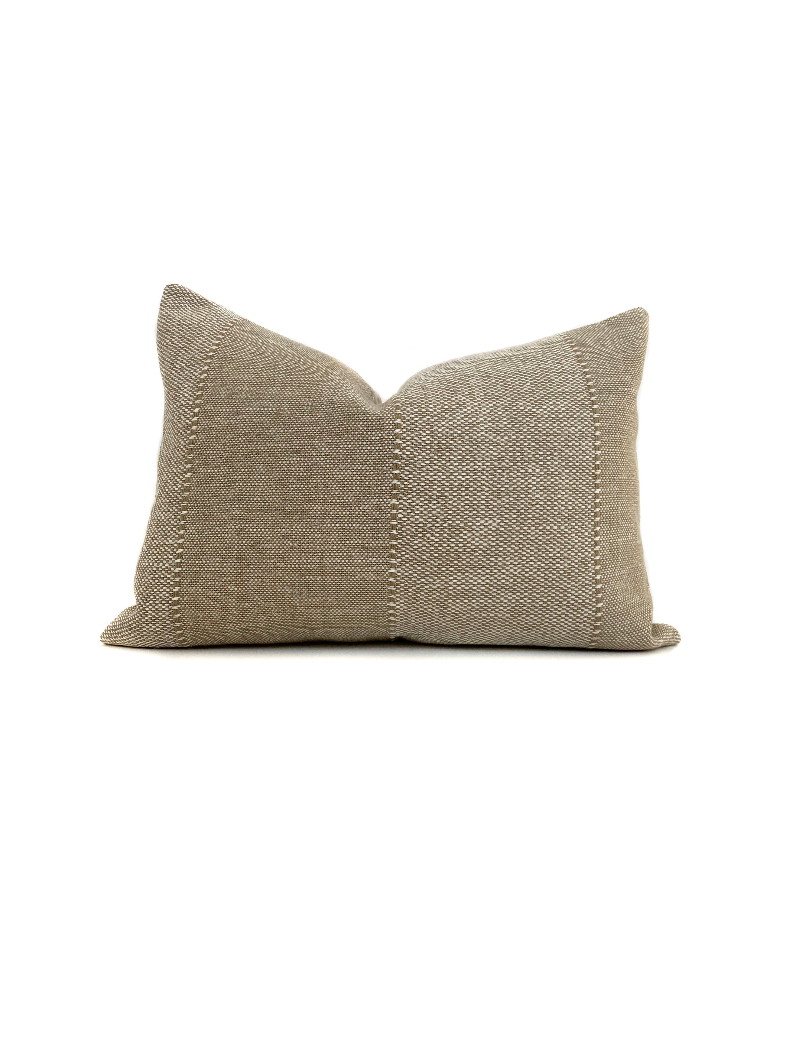 a half pillow that is tan