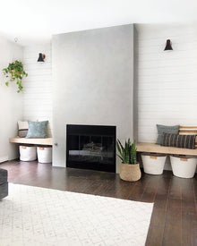 Modern living room with a fireplace in the center